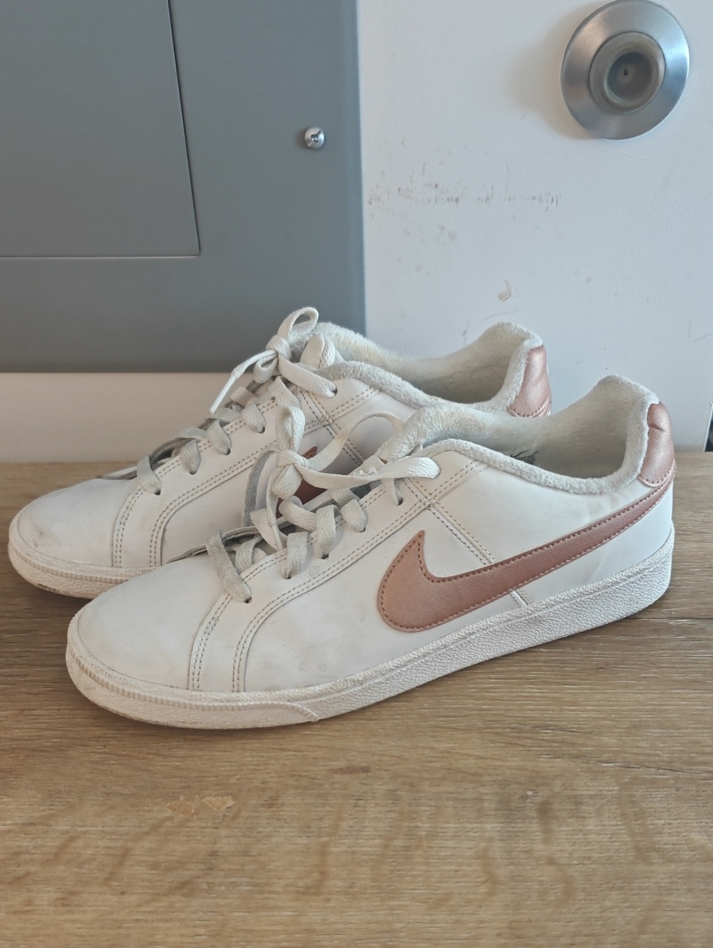 Nike White Low-Top Sneakers with Rose Metallic Swoosh